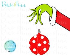 an ornament hanging from a red ball with green hands and polka dots on it