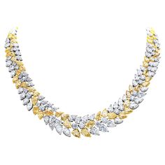 A gorgeous collar necklace, showcasing fancy intense yellow and white diamonds in mixed cuts. Fancy intense yellow pear shape diamonds weigh a total of 37.62 carats with VS-SI clarity. Round brilliant and pear shape white diamonds weigh a total of 41.88 carats with D-F color and VS clarity. Finely set on platinum and 18K yellow gold. Eleven stones within this necklace are GIA certified. Luxury Yellow Fine Jewelry Necklaces, Luxury Gold Plated Diamond Cut Jewelry, Expensive Gold Necklace, Luxury Diamond Drop Necklace In Yellow Gold, Luxury Yellow Gold Diamond Custom Necklace, Wheat Jewelry, Expensive Necklaces, Pear Shaped Diamond Necklace, Yellow Diamond Necklace