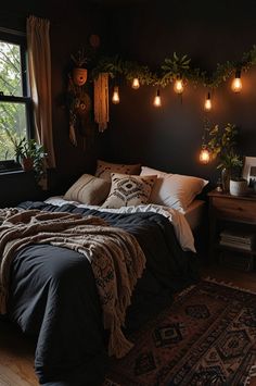 a bed sitting in a bedroom next to a window with lights on the wall above it