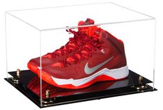 a pair of basketball shoes in a clear case