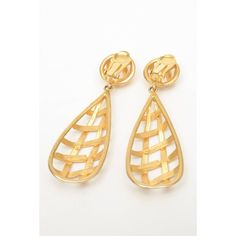 This is part of Chairish’s Costume Jewelry assortment.  This lovely pair of gold plated dangle clip on earrings that have a criss cross design in a cage like form. They are beautiful and dramatic on. They are 3.25" H/L x 1.25" D at the widest part. The button top is 3/4" W. They look like runway pieces. Very au courant now and modern. Makes a statement!! Tres Chic! These are from the 80's. These will be fabulous for any season day to evening wear. Cross Design, Button Top, Tres Chic, Cross Designs, Evening Wear, Clip On, Criss Cross, Costume Jewelry, Clip On Earrings