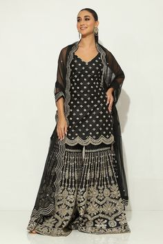 Black padded kurta featuring mirrorwork embellished floral buttis, side slits and scalloped borders. Comes with embellished gharara and scalloped border dupatta. - Aza Fashions Kurta Patterns, Scalloped Border, Dupion Silk, Set For Women, Aza Fashion, Borders, Destination Wedding, Types Of Sleeves, Custom Made