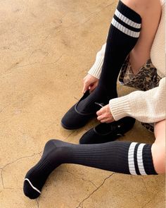 Introducing the Knee High Boyfriend Socks, a modern take on classic retro tube socks inspired by the beloved original Boyfriend Socks. These socks reach just below the knee with their signature double sporty stripe. They effortlessly combine function and fashion, offering endless styling possibilities and promised comfort. The details- One size fits most (US women's size 6-10) 85% cotton, 13% polyester, 2% spandex Machine wash cold, tumble dry low Black Casual Socks For Spring, Casual Black Socks For Spring, Casual Black Knee-high Socks, Black Socks For Fall Streetwear, Black Fall Streetwear Socks, Casual Black Mid-calf Socks, Trendy Knee-high School Socks, Casual Stretch Knee-high Socks, Trendy Black Mid-calf Socks