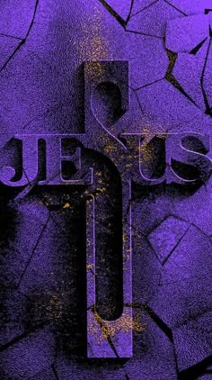 the word jesus is painted in purple and black on a cracked surface with yellow streaks