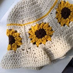 a crocheted bag with sunflowers on it