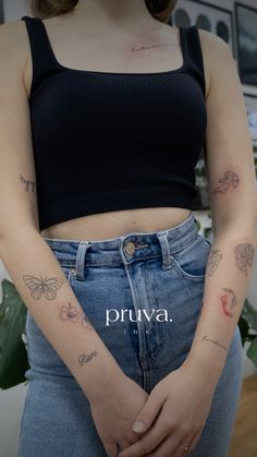 a woman with butterfly tattoos on her arm and chest, standing in front of a potted plant