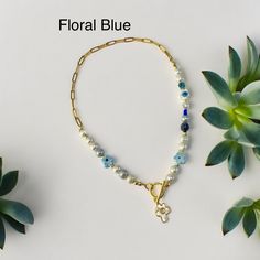 Hurry Early summer sale is on at 50% off! Originally listed at $39.95, now $19.95 only No returns no exchanges on sale items, will be packaged in a bubble envelop only! Spring and summer floral necklaces. Available in different colors of flowers, yellow, blue, orange, green, purple. Pls select price remains the same.  These are fun, colorful spring and summer floral necklaces! Made with genuine pearls, floral beads, semi precious stones and gold filled ball bead spacers, chain is gold stainless Blue Beaded Necklace With Pearl Charm For Beach, Blue Beaded Necklaces With Pearl Chain, Blue Beaded Necklaces With Pearl Detail For Gifts, Blue Beaded Necklaces With Pearl Chain For Gift, Blue Pearl Chain Beaded Necklaces As Gift, Blue Beaded Chain Necklace For Vacation, Floral Necklaces, Beaded Pearl Necklace, Colorful Statement Necklace