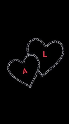 two hearts chained to each other with the letter l on it's back side