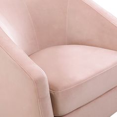 a pink chair sitting on top of a white floor