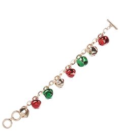 a silver bracelet with red, green and gold bells hanging from it's side