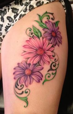 a woman's thigh with flowers painted on it