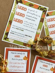 three cards with candy on them sitting next to some gold foil wrapped candies and leaves