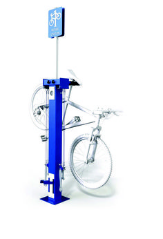 a bicycle is mounted to a blue pole