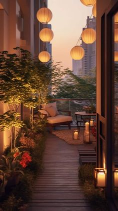 an outdoor walkway with lanterns hanging from it's sides and lit up by candles