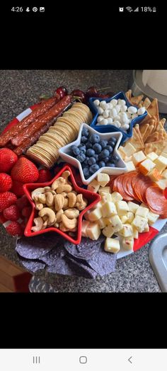 an assortment of fruits and crackers on a plate with the words, i love you