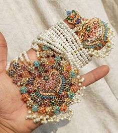 These articles run out of stock very quickly. They take time to be restocked and if needed urgently then shipping rates may vary. Luxury Meenakari Bridal Sets For Ceremonial, Hyderabadi Jewelry Rangposh, Luxury Beaded Chandbali Bridal Necklace, Luxury Elegant Meenakari Bridal Sets, Luxury Meenakari Jewelry For Party, Luxury Meenakari Bridal Necklace For Women, Luxury Meenakari Chandbali Bridal Necklace, Luxury Meenakari Bridal Necklace For Puja, Luxury Meenakari Bridal Sets For Ceremonial Occasions