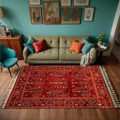 a living room filled with furniture and pictures on the wall above it's red rug