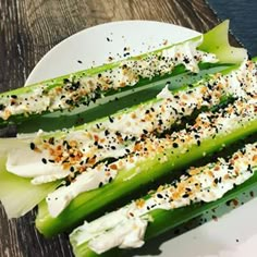 celery spears with cream cheese and black pepper sprinkles on them