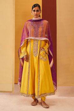 Mango yellow silk organza A-line kurta with zardosi, sequins and gota embroidery. Comes with cowl pant and a purple dupatta.
Components: 3
Pattern: Embroidered
Type Of Work: Zardosi, Sequins, Gota
Neckline: Round
Sleeve Type: Flared Sleeves
Fabric: Silk organza
Color: Yellow
Other Details: 
Pocket detailing on kurta
Occasion: Mehendi and Haldi - Aza Fashions Yellow Georgette Sets With Sheer Dupatta, Designer Yellow Raw Silk Dress, Bollywood Yellow Organza Anarkali Set, Yellow Bollywood Anarkali Set In Organza, Yellow Bollywood Organza Anarkali Set, Festive Yellow Organza Set, Yellow Organza Anarkali Set With Traditional Drape, Yellow Anarkali Set With Sheer Dupatta, Yellow Organza Anarkali Set For Eid