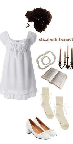 a woman's outfit and accessories including shoes, socks, candlelight candles and an open book