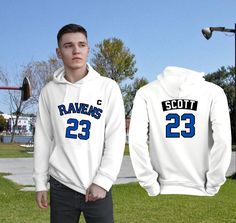 These comfortable hoodies and tees have the look of the Tree Hill Raven's basketball jerseys with Nathan's number 23 and the "C" for Captain. The front of the hoodie says "Ravens 23" with the "C" and the back has Scott and the number 23. We also have blue and black jersey style hoodies & t-shirts and some with Lucas' #3, so make sure to check out those listings as well. This will make a great gift for fans of the OTH show. Please note: The C "patch" and the black "Scott" name "patch" are not act Nathan Scott Basketball, Tree Hill Ravens, Scott Name, Comfortable Hoodies, Nathan Scott, Lucas Scott, Biological Father, Tee Tree, Black Patch