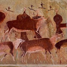 some animals and people are depicted in this rock painting