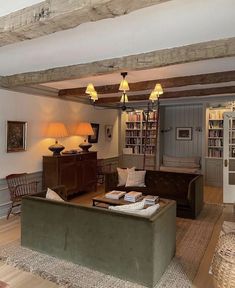 a living room filled with furniture and bookshelves