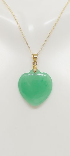 GREEN Jade Heart Charm /Pendant / Necklace. Green Jade HEART in Sterling Silver Over Gold Plated with 16" Chain 2 Inches Extended. Green Jade Heart LOVER. Product Information: - Stone: Green Jade Heart. - Heart Measures: 22mm x 20mm. - Metal: Silver and Gold Plated. - Chain Length: 16 Inches 2 inches Extended. - Nice Gift Box Included. Green Heart Charm Necklace For Anniversary, Green Necklace With Heart Charm For Anniversary, Green Double Heart Jewelry For Anniversary, Green Heart-shaped Anniversary Necklace, Green Double Heart Charm Jewelry, Green Double Heart Jewelry With Heart Charm, Green Heart Charm Jewelry For Anniversary, Green Heart Charm Necklace For Valentine's Day, Green Heart Necklace With Charm For Valentine's Day