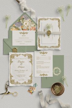 the wedding stationery is laid out on top of each other