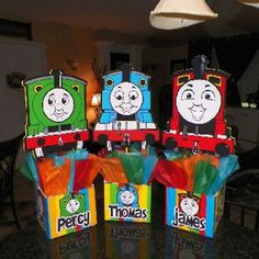 thomas the tank engine birthday treat bags on a table in front of a dining room