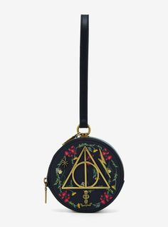 Add a touch of the Dark Arts to your look with this Harry Potter coin purse! Featuring a floral backdrop  the top of this purse also includes metal badges of the Deathly Hallows  the Dark Mark  and a lightning bolt. With a zipper closure  wristlet strap  and a lobster clasp  this coin purse is the perfect accessory for Hogsmeade. Don't forget the other matching coin purses sold separately!A BoxLunch Exclusive!PolyurethaneApprox. 5" W x 5" H x 2 34" DImported Harry Potter Coins, Studio Ghibli Ponyo, The Dark Mark, Ghibli Ponyo, Harry Potter Bag, Fantasy Star, Tee Bag, Embroidered Portrait, Harry Potter Deathly Hallows