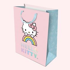 A light pink and blue hello kitty bag with holographic lettering that reads Hello Kitty Gift Bags, Hello Kitty Rainbow, Birthday Gift Bags, Rainbow Sky, Birthday Wrapping Paper, Hello Kitty Birthday, Something Big, Bag Set, Medium Bags