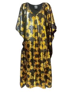 You don't have to wait until spring to bloom, you can get the Any Old Iron Mini Quant Kaftan and bloom all year round! This golden kaftan of happiness has a v-neckline and is decked out in a mini floral pattern from the neckline to the hem. The stunning gold sequins flip to black and the black sequins flip to the vibrant gold. It is perfect for any vacation, event, and performance! The light weight material is super breathable and soft on the skin. This Mini Quant Kaftan is literally the definit Summer Festive V-neck Kaftan, Floral Print V-neck Kaftan For Party, Festive V-neck Kaftan With Floral Print, Festive Gold V-neck Kaftan, Festive V-neck Kaftan, Festive V-neck Sequin Kaftan, Bohemian V-neck Kimono For Party, Festive V-neck Kaftan For Vacation, Gold V-neck Kaftan For Party