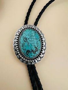 "*Handmade  * Material: genuine Turquoise, Sterling Silver , leather  *This awesome Bolo tie has a Southwestern design and turquoise stone * the Polo nicely , make wonderful gift * polo tie rope length is 38\" * Polo pendant size 2\"x 1 5/8\"" Adjustable Turquoise Bolo Tie For Rodeo, Adjustable Turquoise Bolo Ties For Rodeo, Southwestern Turquoise Lariat Bolo Tie, Silver Sterling Bolo Tie, Turquoise Bolo Tie, Bolo Ties, Southwestern Design, Bolo Tie, Genuine Turquoise