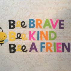 the words be brave, be kind and be a friend written in multicolored letters