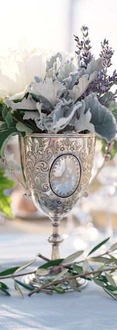 a vase filled with flowers on top of a table