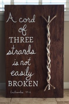 a sign with a rope on it that says, a cord of three strands is not easily broken