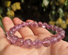 Dear Fellow Light Beings 💜 .  I Am Very Excited To Show You This Beautiful Genuine Amethyst Crystal Bead Bracelet Made Using 8.5-9mm Faceted Beads. This Is Made for a 7 inch wrist    As I am 7 inch and it is Perfect Fit On Me as in the photos! All My Bracelets Come In An Organza Bag and In Their Own Postal Box So Make Perfect Gifts Amethyst is said to be a Powerful & Protective Crystal.   Wearing A Bracelet Is An Amazing Way To Share Your Life With A Crystal And Benefit From Its Amazing Propert Cheap Purple Amethyst Beaded Bracelets, Cheap Bohemian Purple Crystal Bracelet, Cheap Purple Bohemian Crystal Bracelet, Faceted Amythest Bracelet, Amethyst Crystal Bracelet, Light Beings, Purple Tissue Paper, Crystal Bead Bracelet, Universal Energy