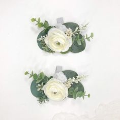 two bridals with white flowers and greenery on the top one is green