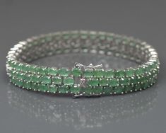 "This Listing is For-: Natural Emerald Bracelet, Three Line Bracelet, 925 Silver Bracelet, Emerald Jewelry, Gemstone Bracelet, Handmade Bracelet, Wedding Bracelet. PRODUCT CODE --- RJ-6079 BIRTHSTONE --- MAY METAL --- 925 STERLING SILVER PRODUCTS TYPE --- BRACELET STONE DIMENSION --- 4X3 MM STONE WEIGHT --- 21.70 CTS. TOTAL WEIGHT --- 22.70 GRAMS Emerald Benefits- *Emerald is known as the \"stone of successful love\". *It brings loyalty and provides for domestic bliss. Emerald stimulates the hea Silver Rondelle Bracelets For Formal Occasions, Elegant Green Bracelets With Sterling Silver Clasp, Emerald Benefits, Bracelet Emerald, Domestic Bliss, Bracelet Stone, Emerald Bracelet, Bracelet Wedding, 925 Silver Bracelet