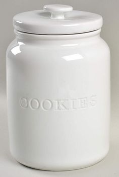 a white cookie jar with the word cookies on it