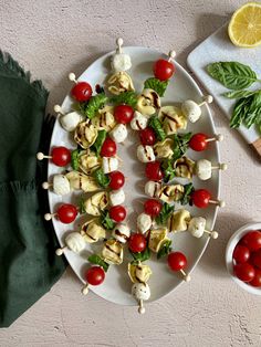 caprese tortellini skewers with balsamic glaze on a plate