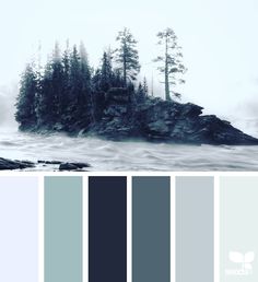 the color scheme is blue and gray with some trees on it in the background, there are