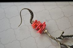 These fun coral dangle earrings feature tiny pieces of vibrant orange/red coral on gold brass coral reef branches, inspired by snorkeling in Hawaii's beautiful underwater world - vibrant and full of life. The metal coral branches are double sided so the earrings are beautiful from all angles. They are very lightweight and perfect for daily wear! Available in silvertone and gold/brass. The ornate ear hooks feature a carved design which compliments the reef branches and are hypoallergenic. Total l Coral Beaded Earrings For Gifts, Bohemian Coral Dangle Earrings, Handmade Red Coral Dangle Earrings, Red Coral Earrings As Gift, Unique Red Brass Earrings, Handmade Coral Earrings In Red Coral, Handmade Coral Bohemian Earrings, Handmade Bohemian Coral Earrings, Beautiful Underwater