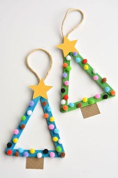 two christmas tree ornaments made out of construction paper