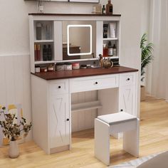 a white desk with a mirror and stool