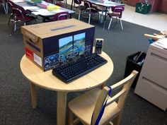 an open box sitting on top of a wooden table next to a keyboard and mouse