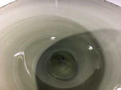 the inside of a glass vase with a circular design on it's rim and bottom