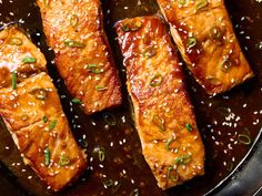 salmon fillets with sesame seeds in a skillet