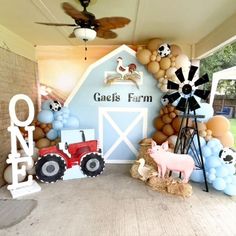 a farm themed birthday party with balloons and decorations